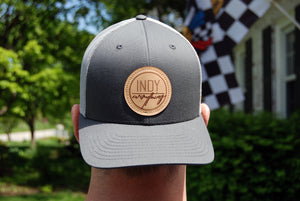 TRUCKER HAT - CHARCOAL AND GREY W/ LEATHER BADGE - Indy Over Everything