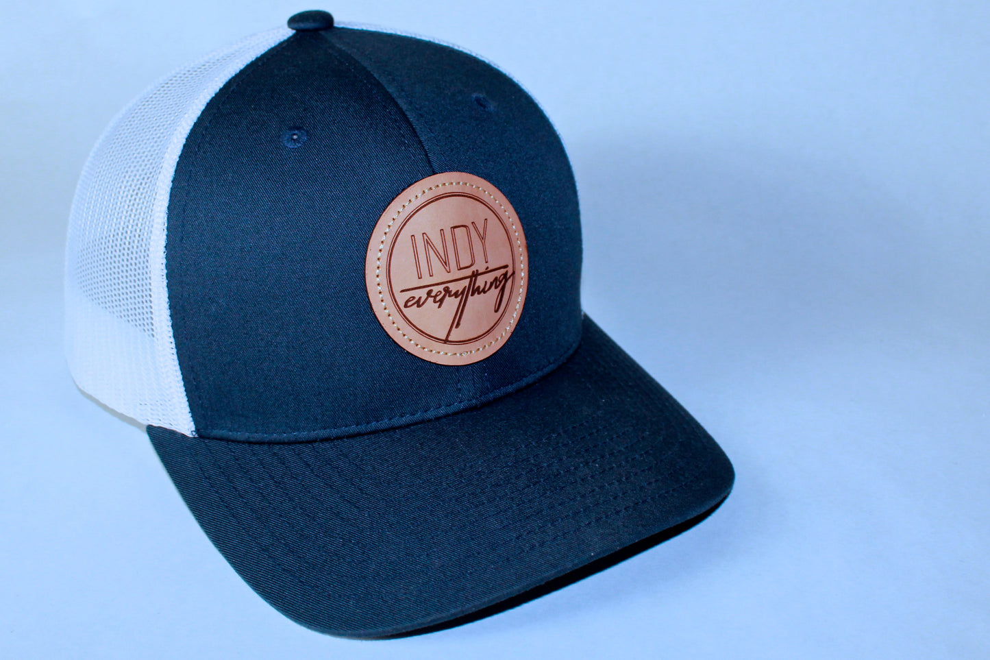 TRUCKER HAT - NAVY AND WHITE W/ LEATHER BADGE - Indy Over Everything