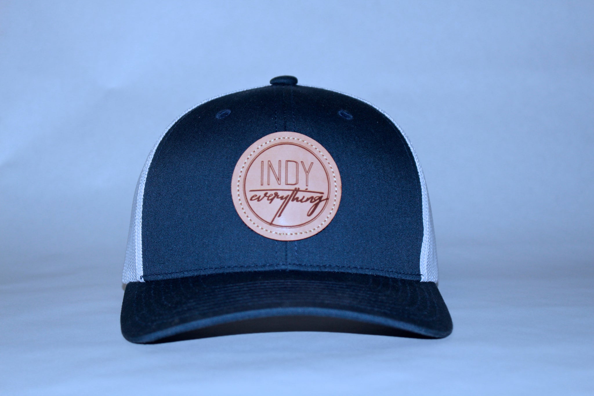 TRUCKER HAT - NAVY AND WHITE W/ LEATHER BADGE - Indy Over Everything