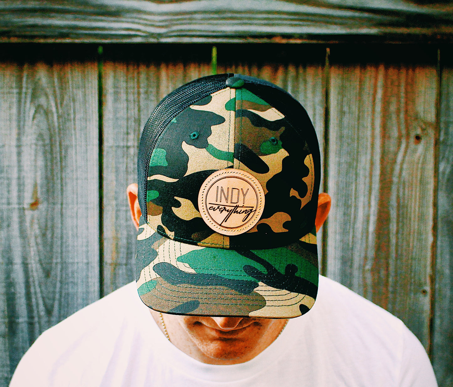 TRUCKER HAT- CAMO AND BLACK W/ LEATHER BADGE - Indy Over Everything