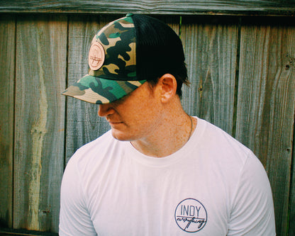 TRUCKER HAT- CAMO AND BLACK W/ LEATHER BADGE - Indy Over Everything